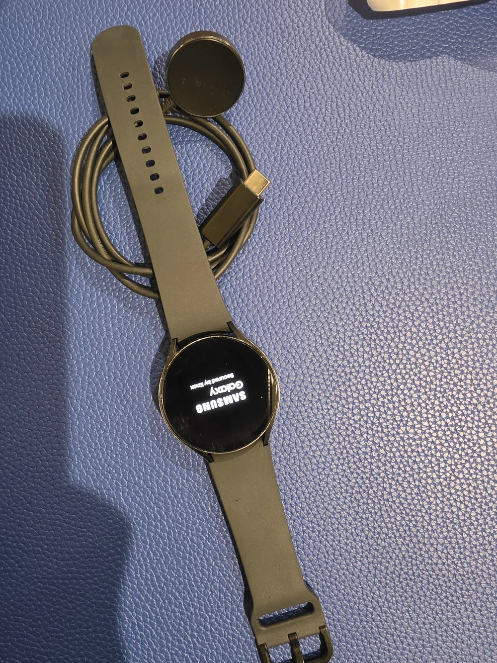 Black Round-Face Smartwatch with Charging Dock